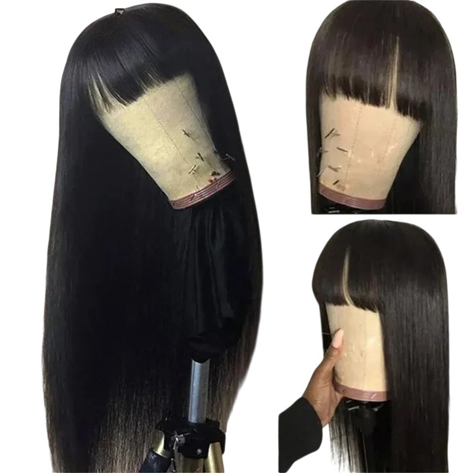 RitzWigs straight black human hair wig with bangs on a mannequin head, showing a sleek, beginner-friendly style.