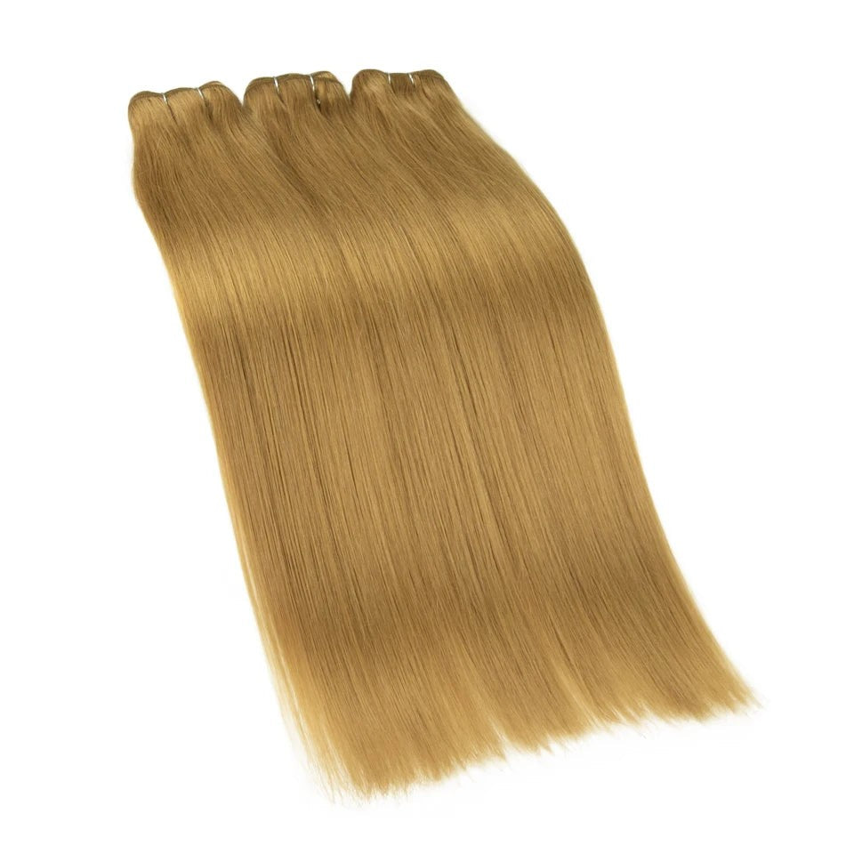 RitzWigs straight human hair weft extensions in a lustrous golden blonde shade with a silky smooth finish.