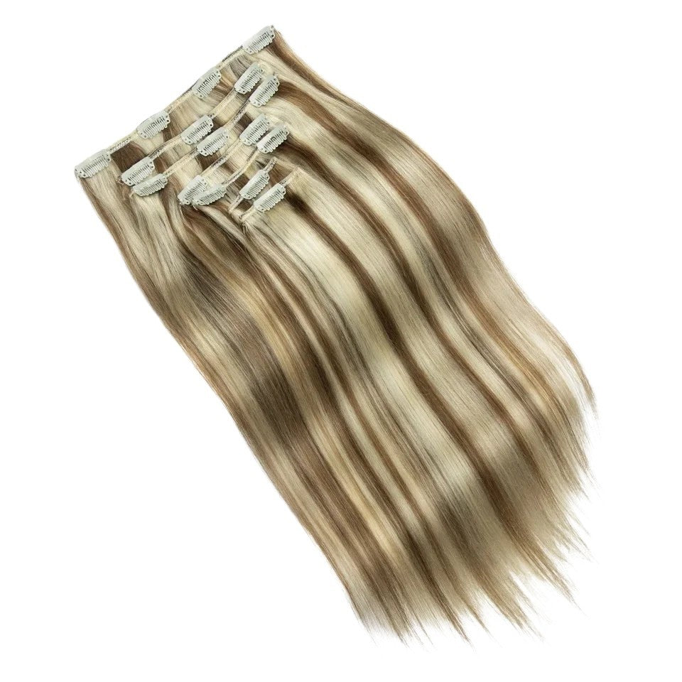 RitzWigs straight human hair clip-in extensions featuring honey blonde and brown highlights in a 7-piece set