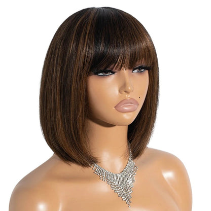 RitzWigs short straight human hair bob wig with bangs and brown highlights on a mannequin head