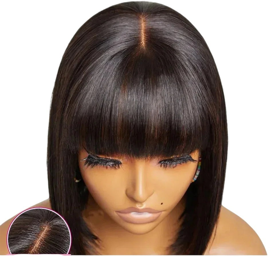 RitzWigs Brazilian human hair bob wig with bangs and realistic scalp, featuring a straight texture in natural black.