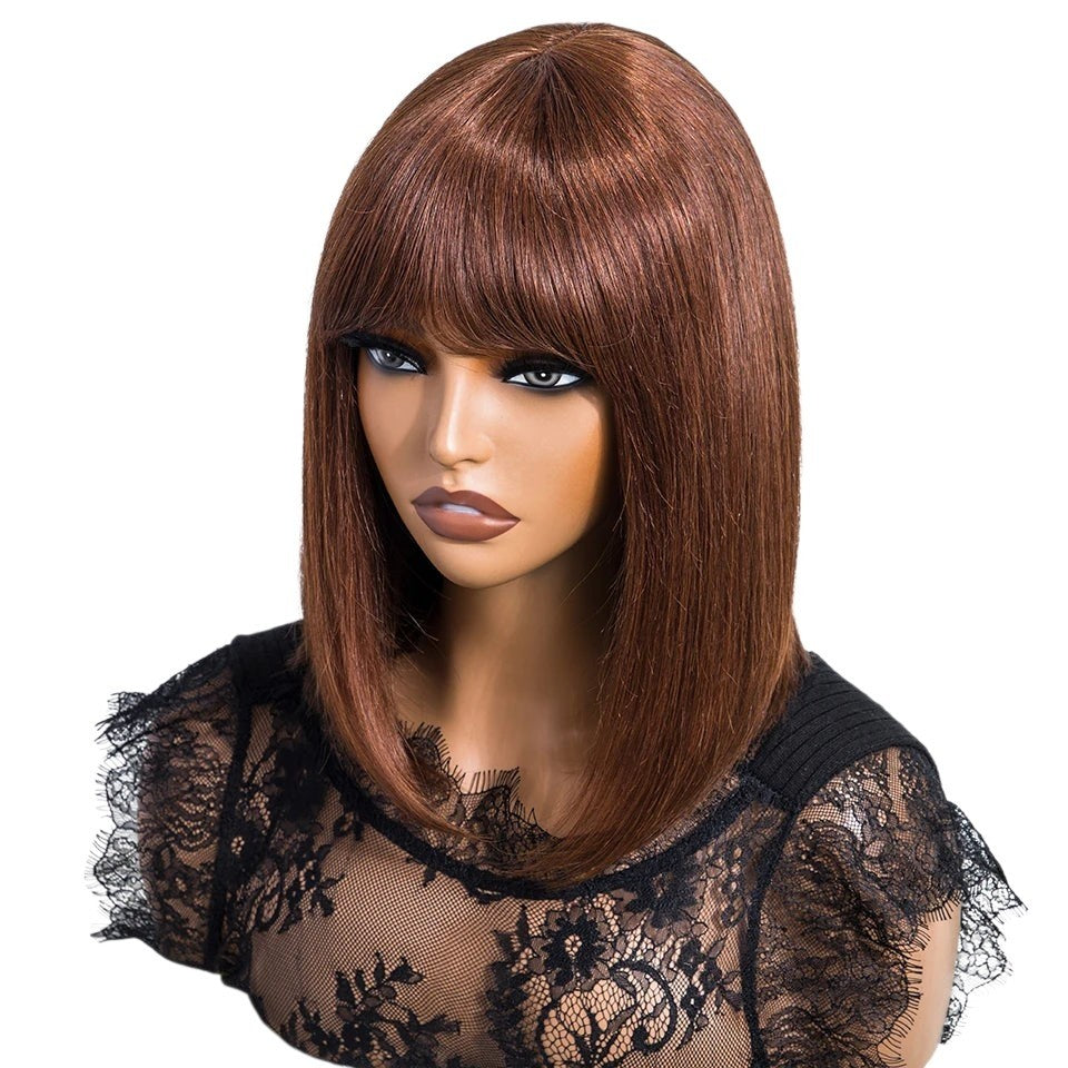RitzWigs straight brown bob human hair wig with bangs on a mannequin head