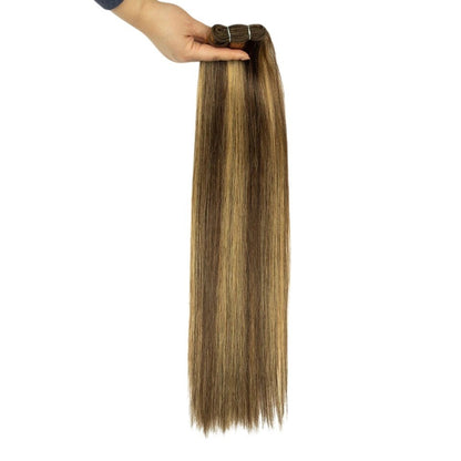 RitzWigs straight Remy human hair weave bundle with P4/27 brown and blonde highlights held by a hand