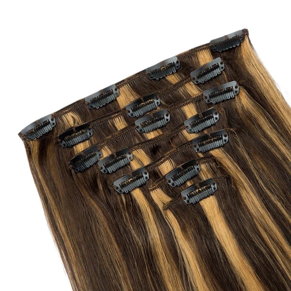 RitzWigs straight human hair clip-in extensions featuring a highlighted honey blonde and dark brown colour blend.