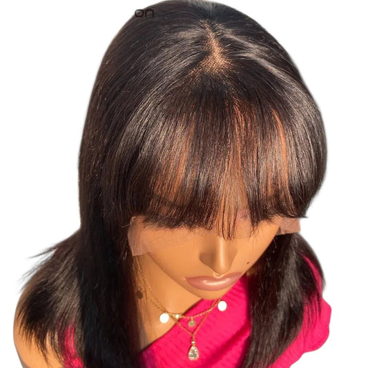 RitzWigs straight human hair bob wig with bangs and transparent lace part on a mannequin head
