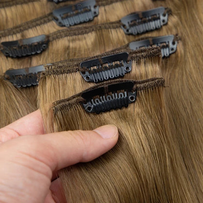 RitzWigs straight human hair extensions in a light brown shade with secure metal clips for easy application