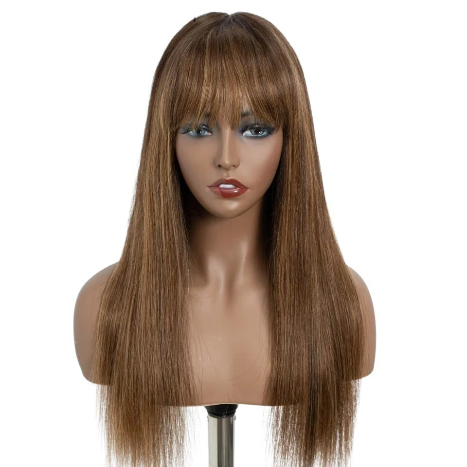 RitzWigs straight human hair wig with bangs on a mannequin head, featuring a natural light brown colour.