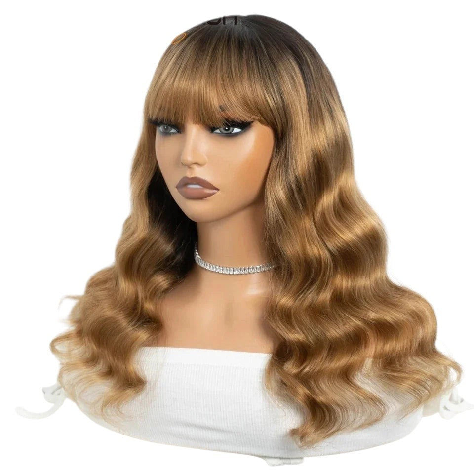 RitzWigs Brazilian human hair wig with bangs, featuring a wavy texture and ombre brown colour on a mannequin head.